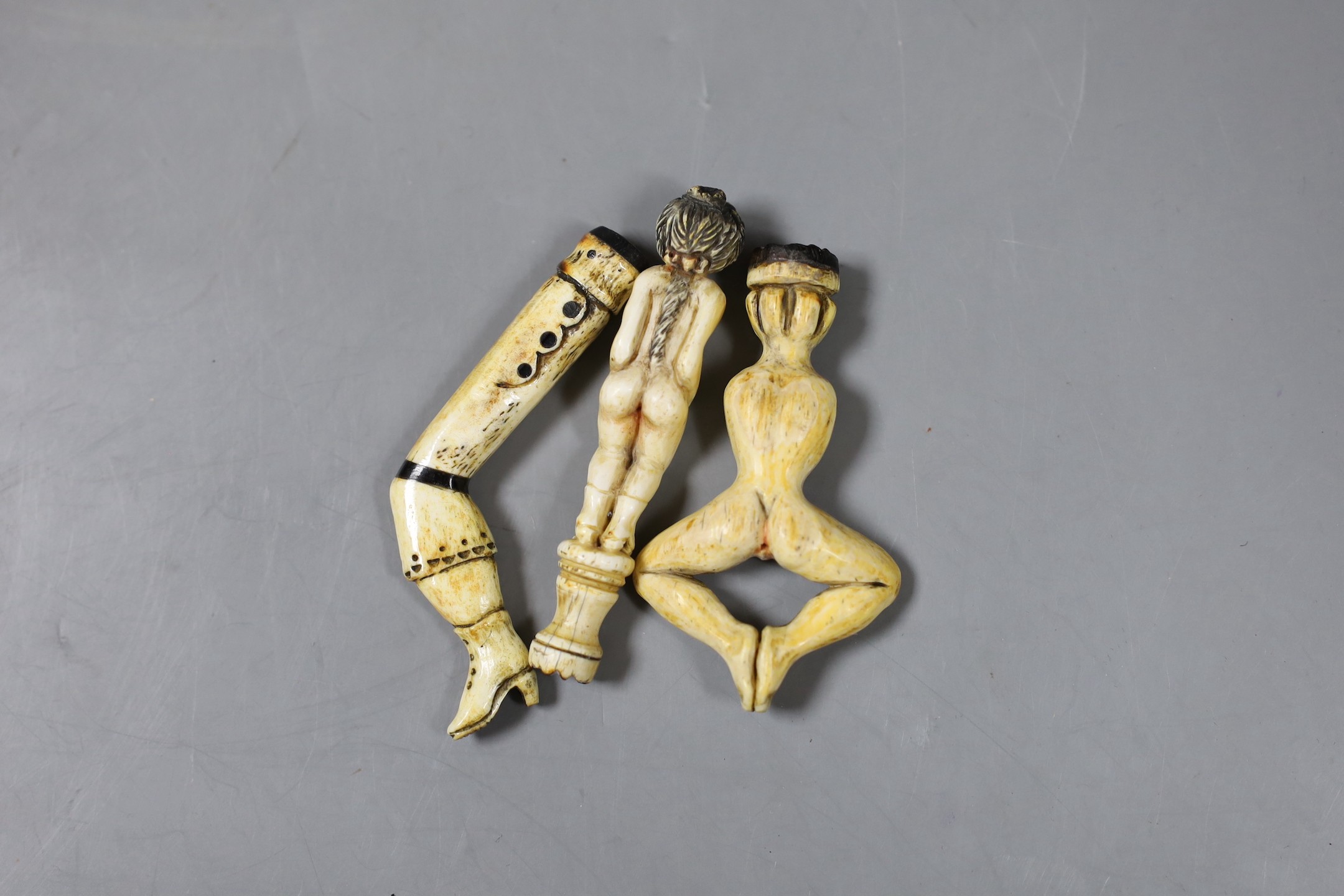 Three prisoner of war bone pipe tamper figures